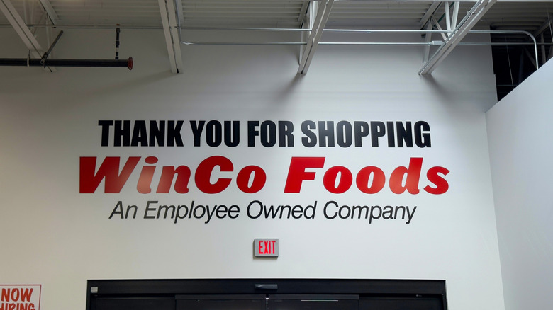 A painted sign thanks customers for shopping at WinCo