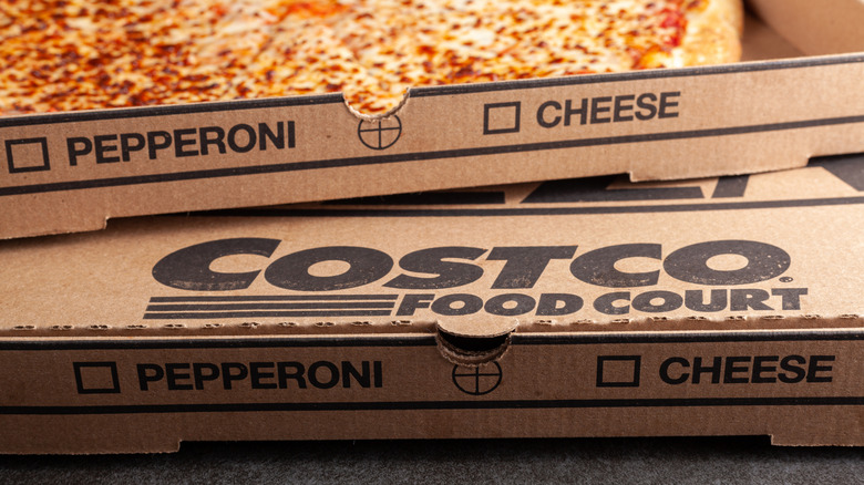 Costco cheese pizza and box with Costco Food Court logo.