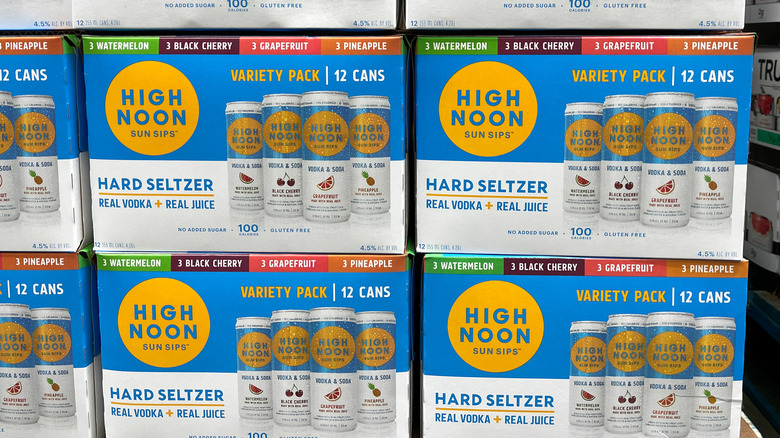 Stacks of High Noon seltzer boxes.