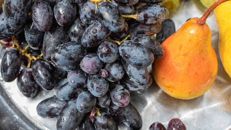 Grapes and pear on platter