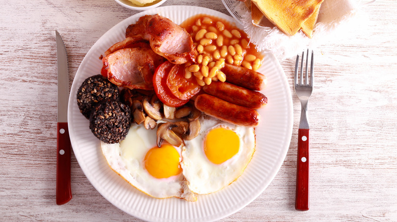 Full English breakfast on white plate