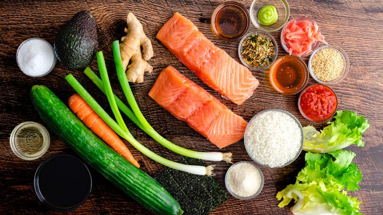 Sushi bowl ingredients: Raw salmon, sushi rice, vegetables, and other ingredients