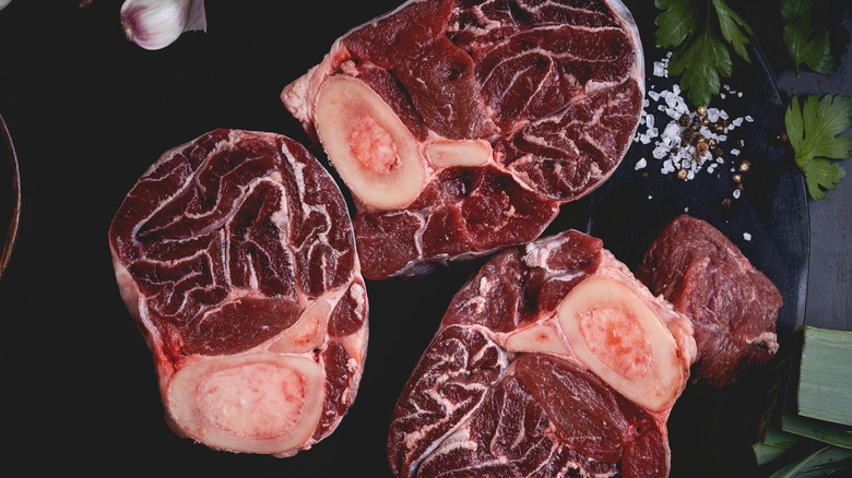 Raw osso buco, fresh veal cut meat with salt and pepper