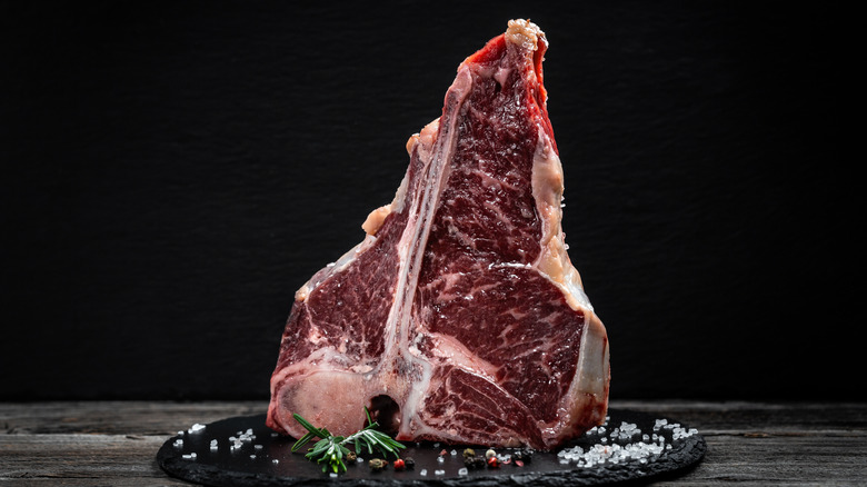 The T-bone or porterhouse steak of beef cut from the short loin