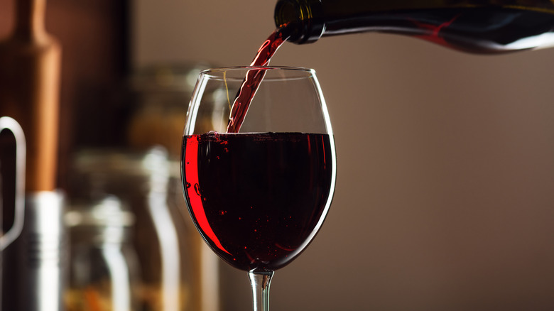 Pouring red wine into glass