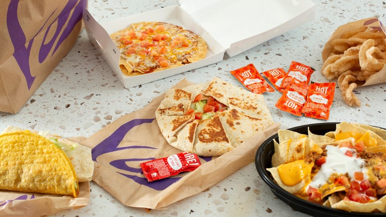 Various menu items from Taco Bell on table