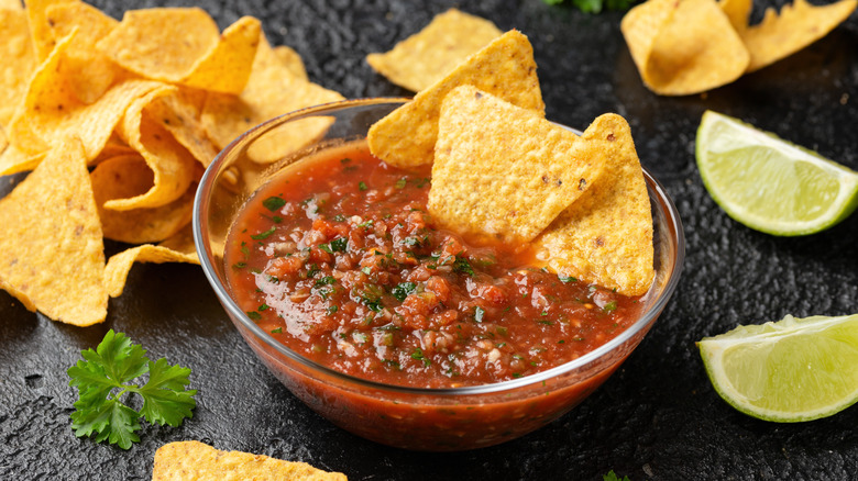 Salsa with limes and nachos