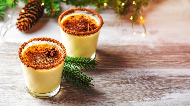 Pair of eggnog glasses with spiced garnish