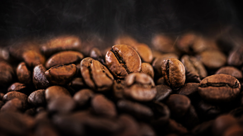 Hot coffee beans on a dark background