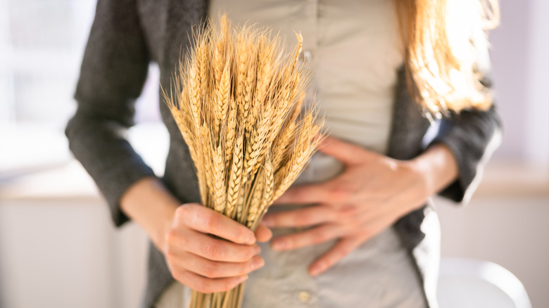 Woman with a handful of wheat