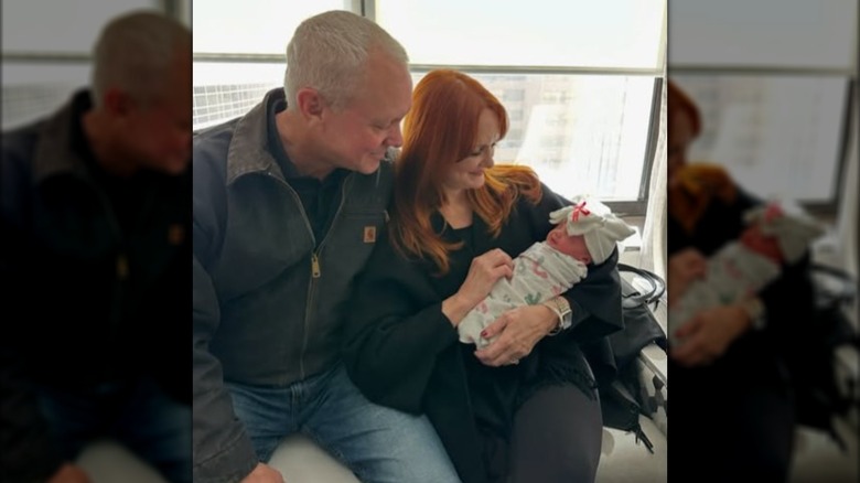 Ladd and Ree Drummond holding their granddaughter