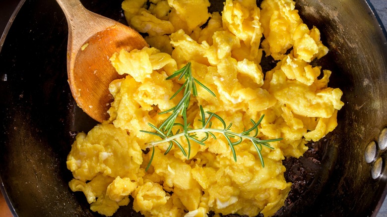 fluffy scrambled eggs in a pan