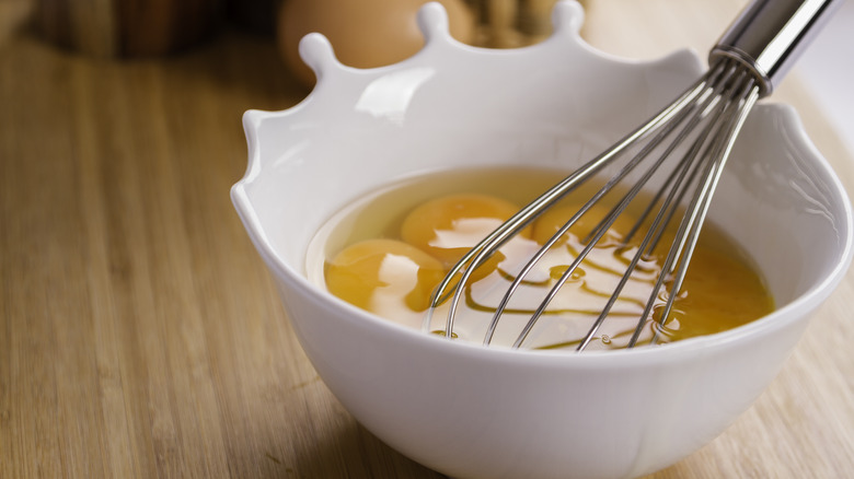 whisking eggs in bowl