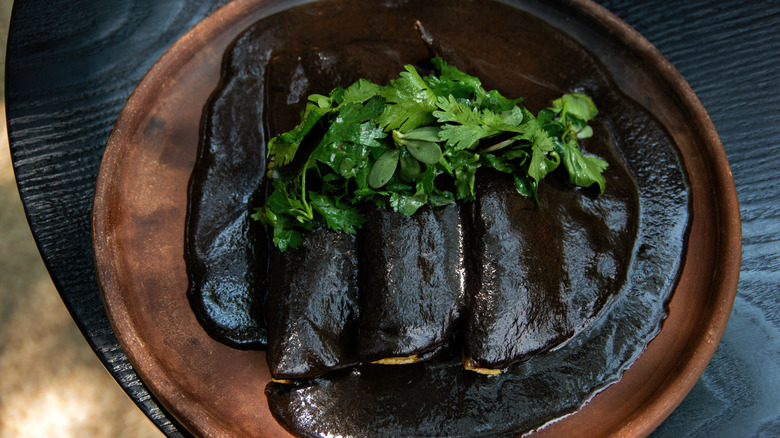 Black mole tortillas with cilantro