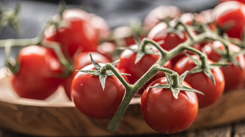 tomatoes on wood platter