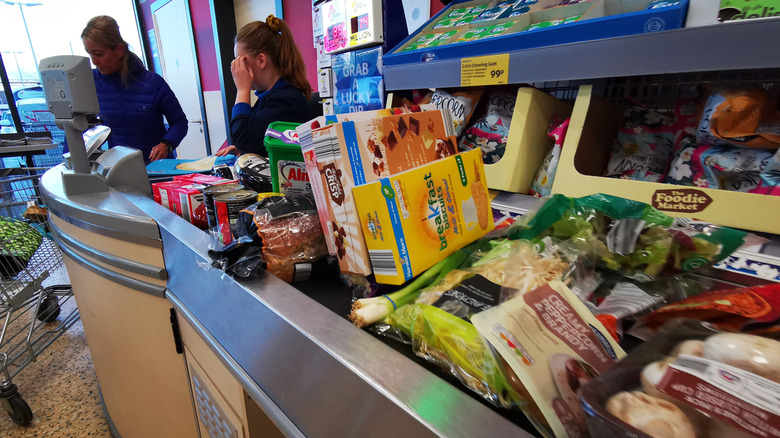 Groceries on an Aldi conveyor belt at checkout