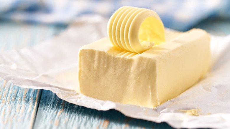 Slab of butter on table with forked ridge on top