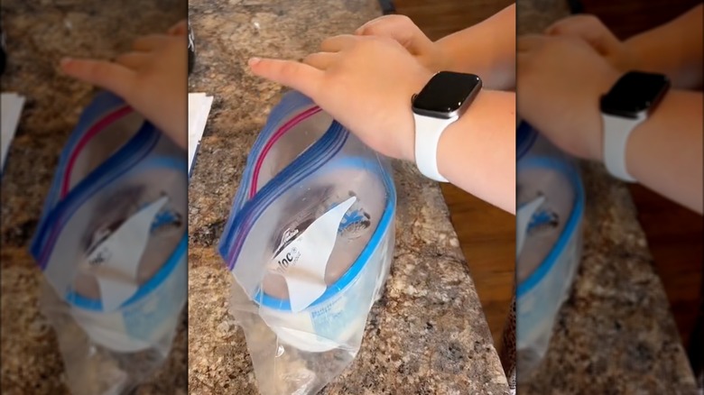 Putting ice cream carton into plastic bag