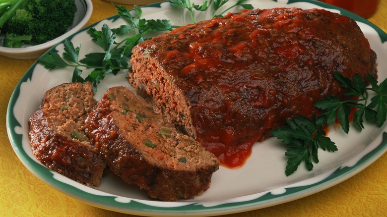 Meatloaf on white plate with parsley