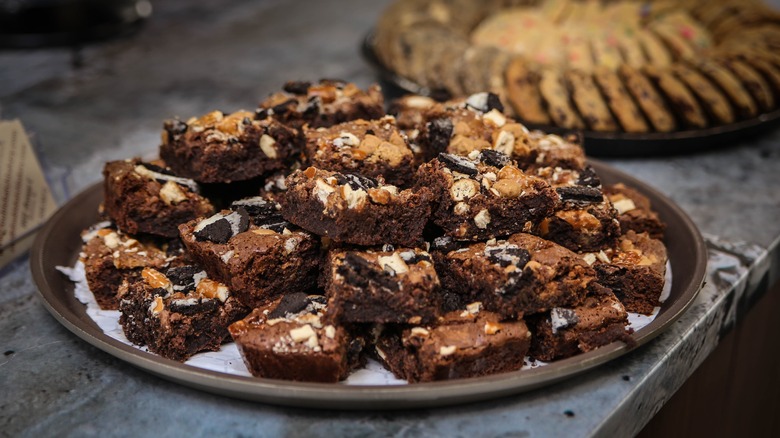 Tray of brownies with nuts and cookie pieces