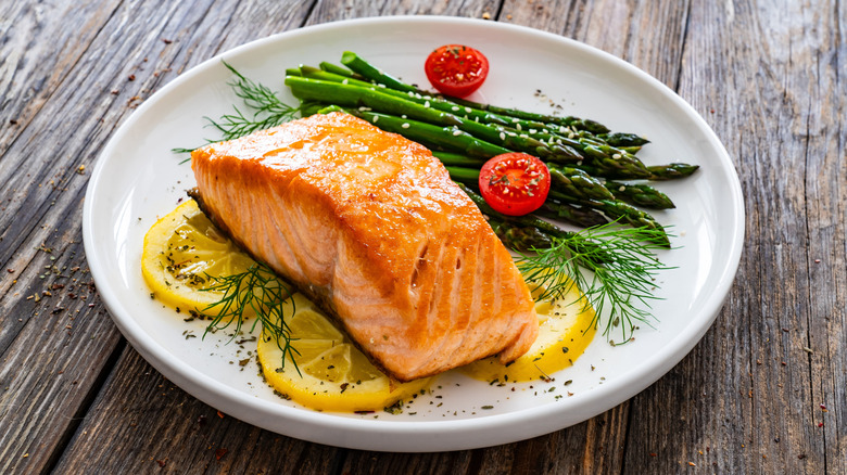 Salmon on a plate with veggies.