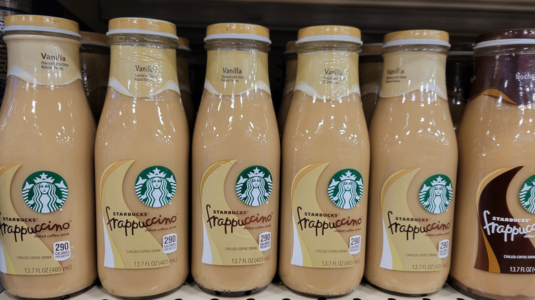 Bottles of vanilla Starbuck frappuccino stocked on a shelf.