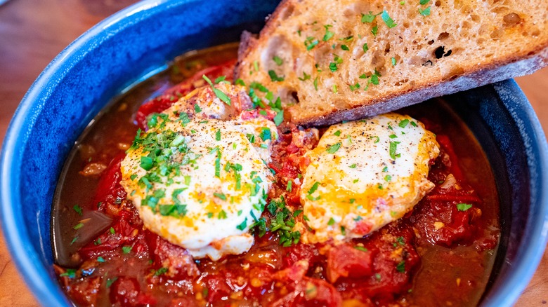 Eggs poached in tomato sauce