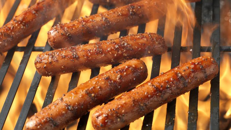 Seasoned hot dogs on a grill