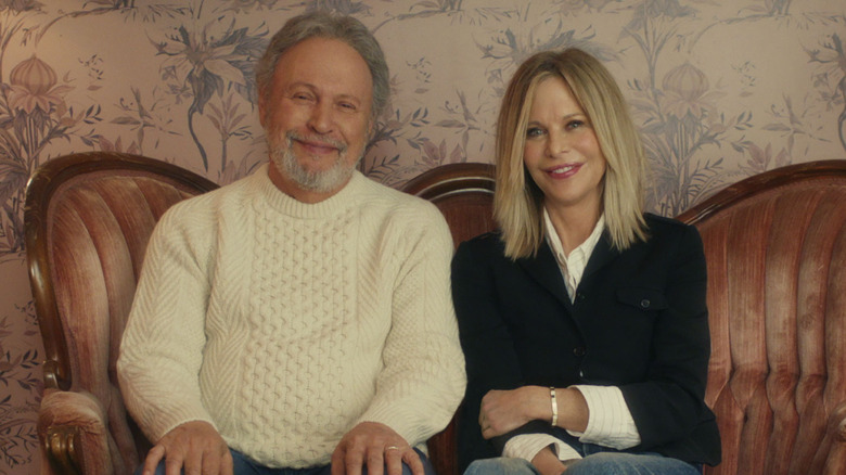 Billy Crystal and Meg Ryan sitting on couch