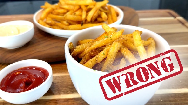 French fries condiments white bowls