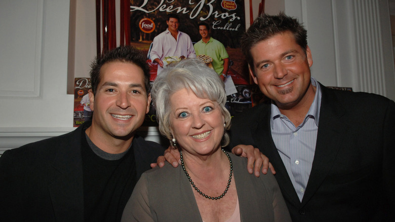 Paula Deen standing between her sons Bobby and Jamie