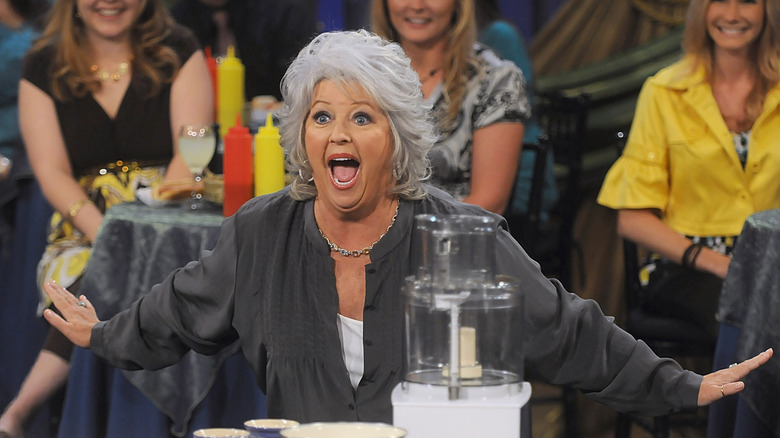 Paula Deen on the set of her show Paula's Party, wearing a grey shirt