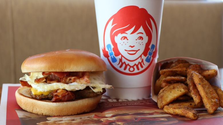 Wendy's Breakfast Baconator with seasoned potatoes and drink cup