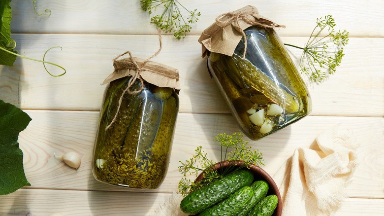 flat lay of two jars of homemade pickles