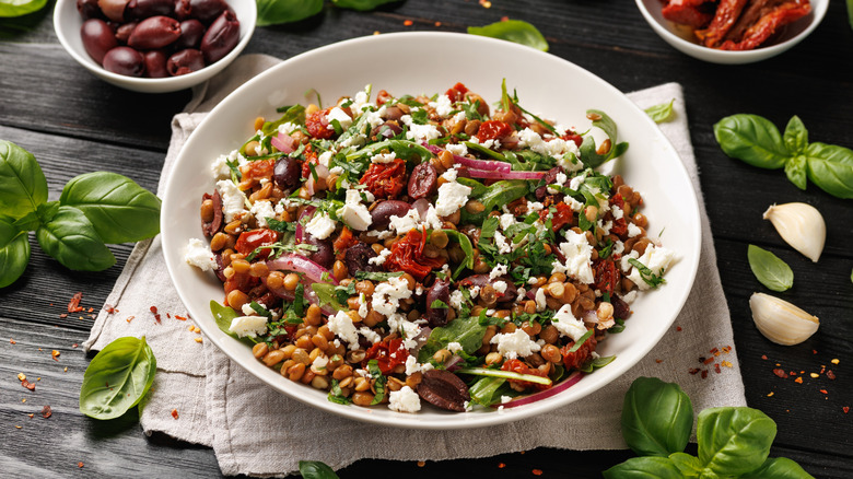 Salad topped with fresh goat cheese.