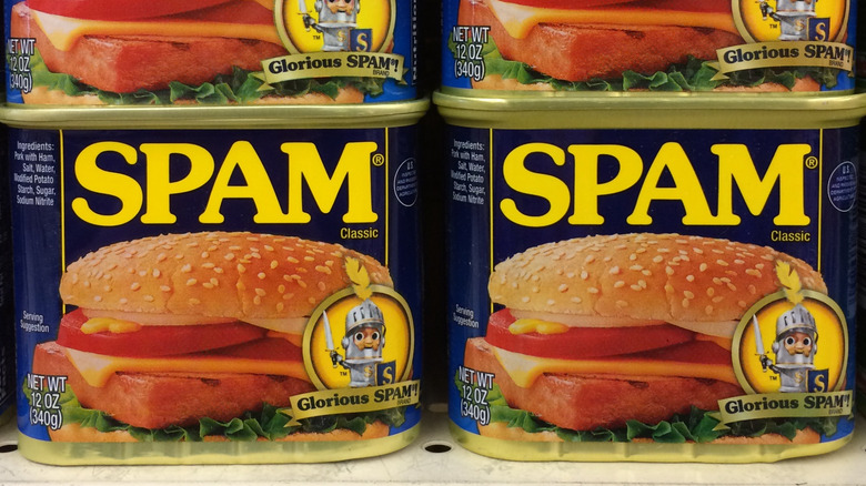 stacked Spam cans on grocery shelf.