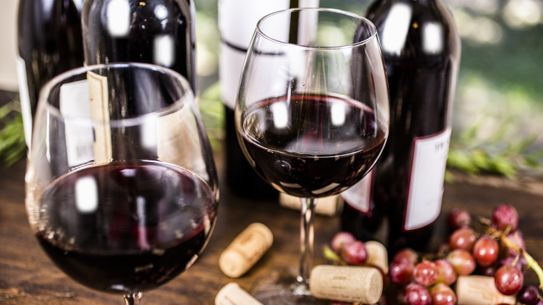 wine on table with grapes