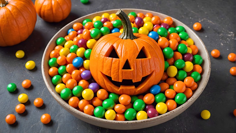 Bowl with candy and Jack-O-Lantern