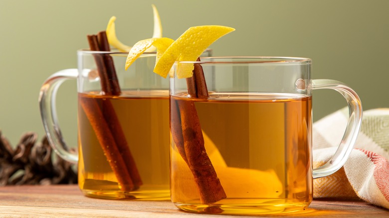 spiked cider with cinnamon stick