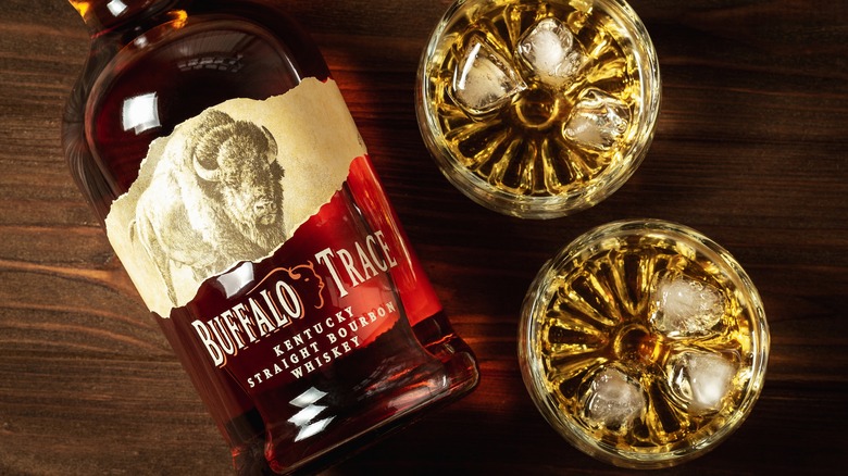 Bottle of Buffalo Trace bourbon with glasses