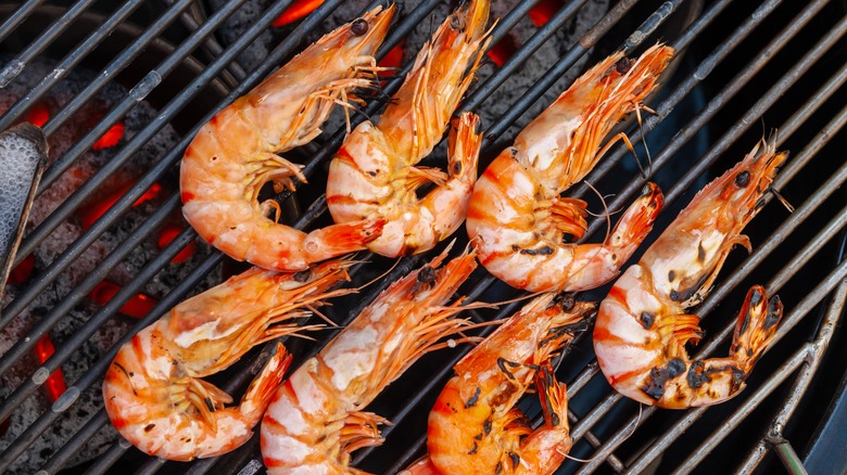 Shrimp in shell cooking on the grill