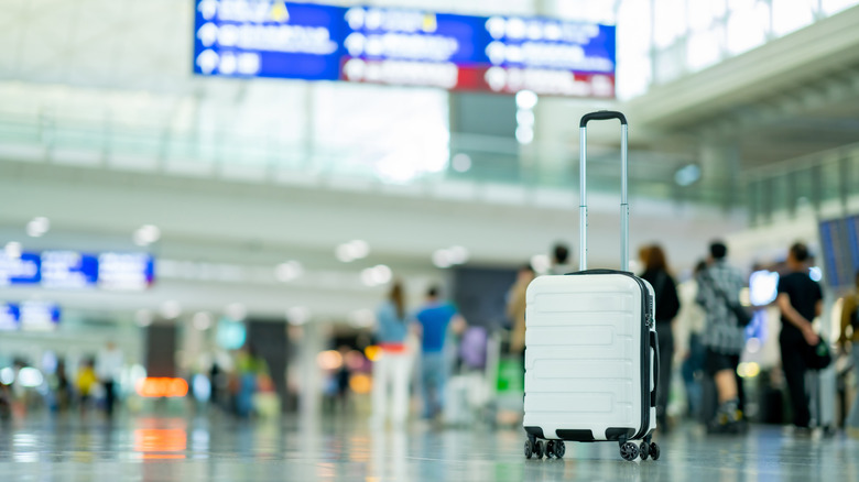 Suitcase in airport terminal