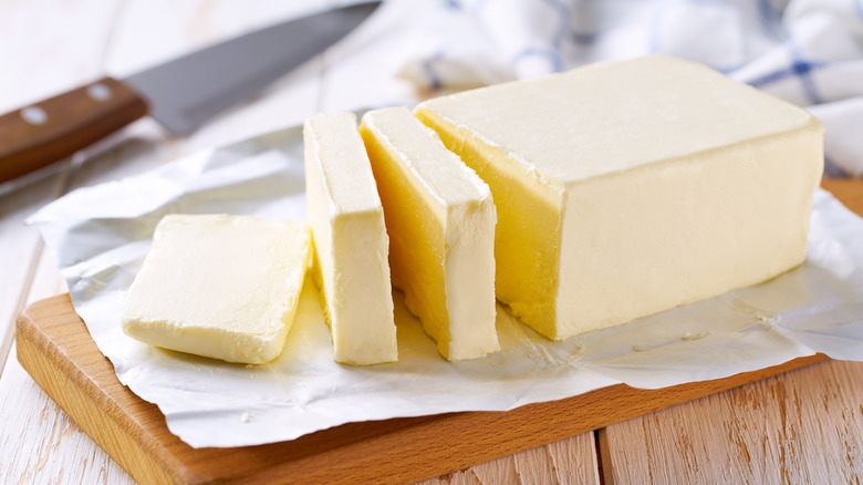 Butter on a wooden block.