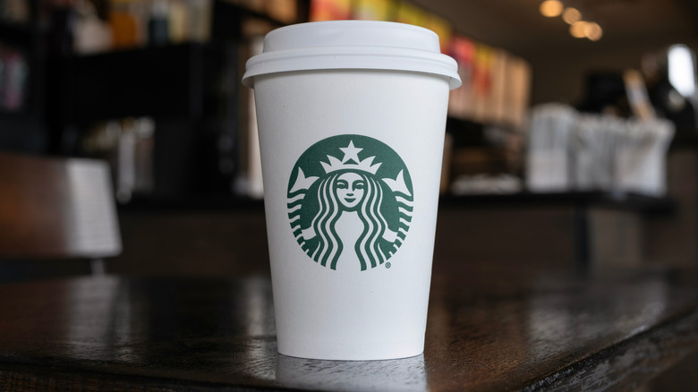 Close-up of a Starbucks cup on a counter