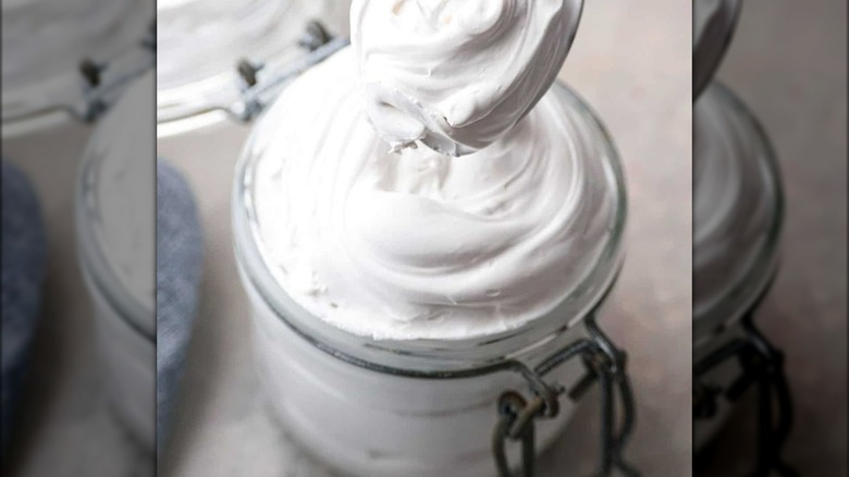 Marshmallow fluff in jar with spoon