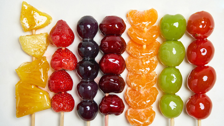 skewers of various candied fruits