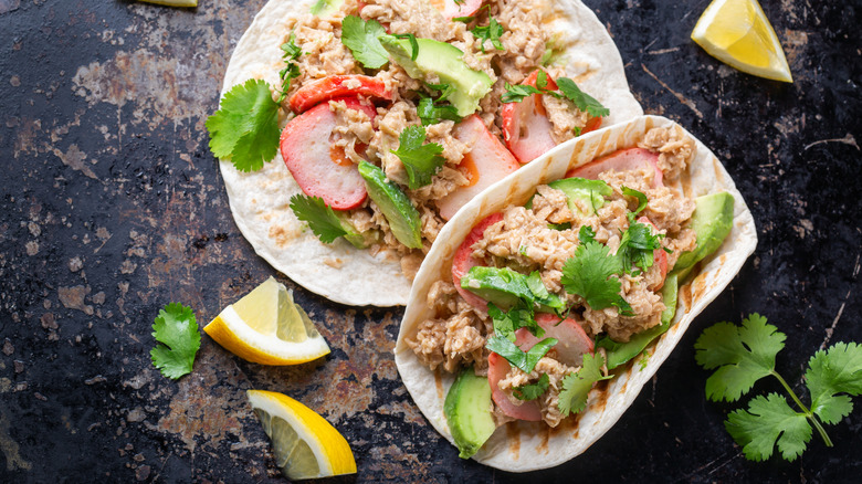 Canned tuna and other toppings on tortilla