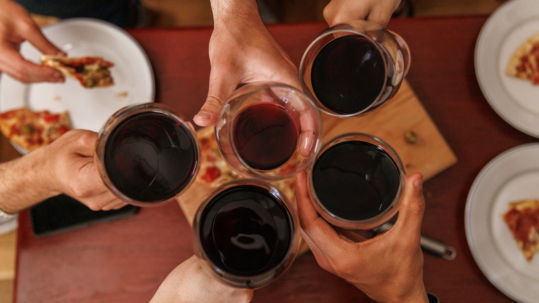 people drinking red wine