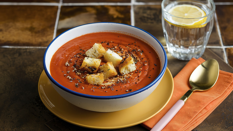 Tomato soup topped with spices and bread crumbs