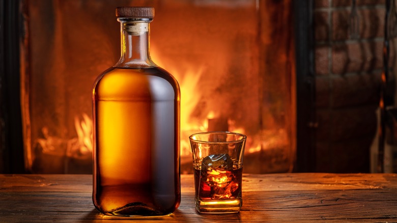 Bourbon bottle and glass fireplace background